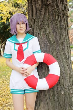 Kagawa, Japan - November 20, 2016: Young japanese girl dressed in cosplay costume at Mamugame-Jou Park. Photo taken in Marugame Cosplay Convention during a meeting of cosplayer.
