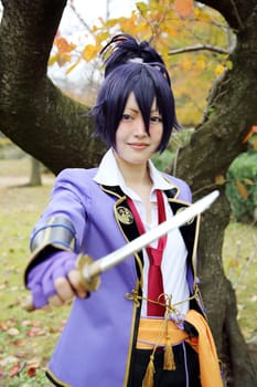 Kagawa, Japan - November 20, 2016: Young japanese girl dressed in cosplay costume at Mamugame-Jou Park. Photo taken in Marugame Cosplay Convention during a meeting of cosplayer.