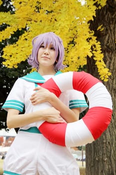 Kagawa, Japan - November 20, 2016: Young japanese girl dressed in cosplay costume at Mamugame-Jou Park. Photo taken in Marugame Cosplay Convention during a meeting of cosplayer.