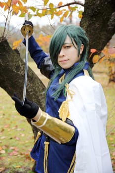 Kagawa, Japan - November 20, 2016: Young japanese girl dressed in cosplay costume at Mamugame-Jou Park. Photo taken in Marugame Cosplay Convention during a meeting of cosplayer.