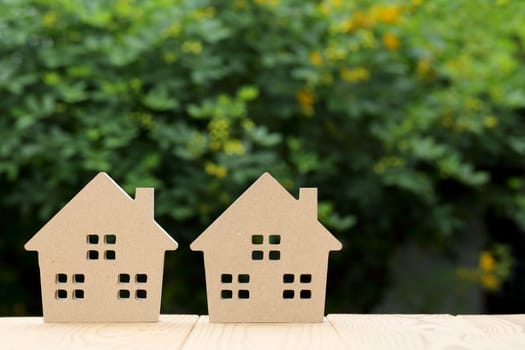 Wooden toy house with natural colored toy blocks