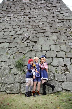 Kagawa, Japan - November 20, 2016: Young japanese girl dressed in cosplay costume at Mamugame-Jou Park. Photo taken in Marugame Cosplay Convention during a meeting of cosplayer.