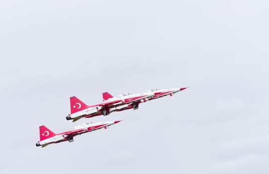 LEEUWARDEN, NETHERLANDS - JUNE 6, 2016: Turkish Star air force demonstration tean performing their stunts during the Dutch Air Force open days