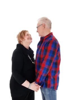 A very happy senior citizen couple smiling at each other in love,.isolated for white background..