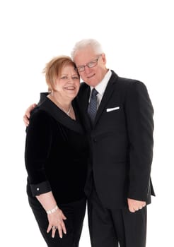 A lovely older couple standing in suits, hugging each other in full lengths.isolated for white background..