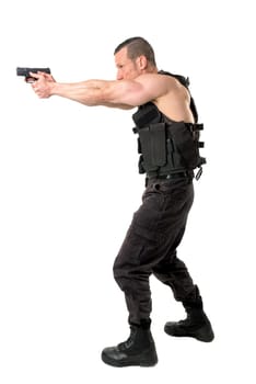 Man with tactical vest and gun isolated in white
