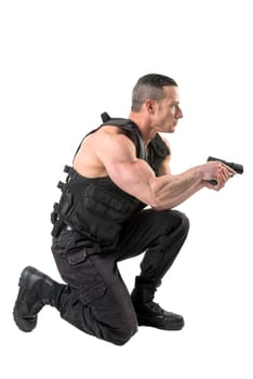 Man with tactical vest and gun isolated in white
