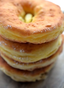 Photo freshly baked pulled out Küchle doughnuts with icing sugar