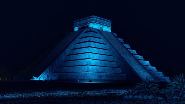 Pyramid of Chichen Itza at night with blue light in Mexico