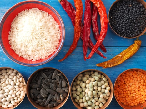 Colorful food ingredients on a blue wooden kitchen table