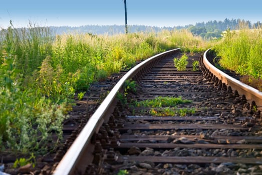 Detail image of railway on the meadow.