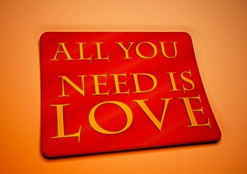 Dimensional inscription All you need is LOVE on background. 3D rendering.