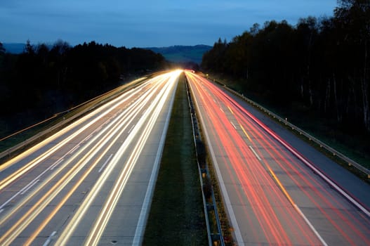 Long exposure shot of highway at night.