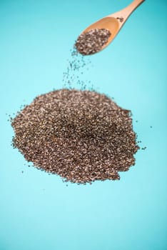 Close-up of ealthy chia seeds in a spoon. Text space.