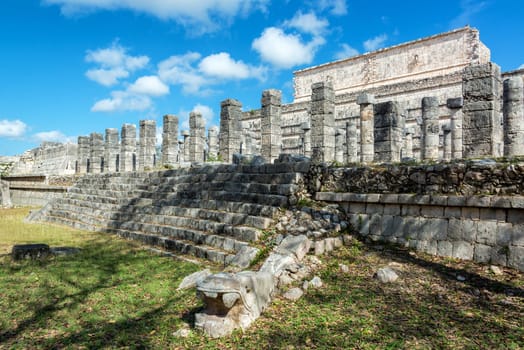 Snake head in front of the Thousand Columns in the ruins of Chichen Itza, Mexico