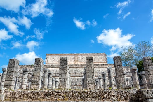 Plaza of the Thousand Columns with the Temple of the Warriors in the background in the ruins of Chichen Itza, Mexico