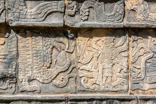 Closeup view of details on the platform of the Eagles and Jaguars in the Mayan ruins of Chichen Itza, Mexico