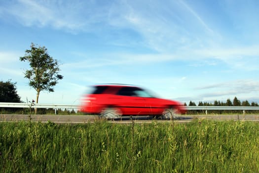 Lawn on German roads. Frenzy with the car on the street. Driving too fast in road traffic