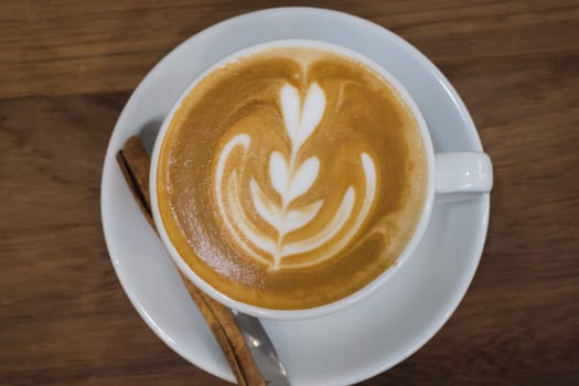 Coffee With Latte Art On Wooden Table, stock photo