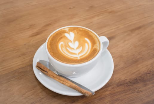 Coffee With Latte Art On Wooden Table, stock photo