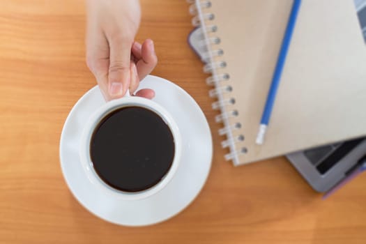 Hot Cup Of Coffee On Working Table, stock photo