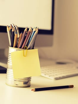 Sticky note close up on an office work space, selective focus retro film style