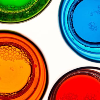 Top view of four empty colored glasses