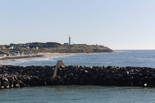 The coastline of Hirtshals and a lighthouse in the background.