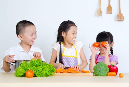 kids having fun with cooking. Healthy eating concept.