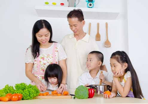 Asian family in the kitchen