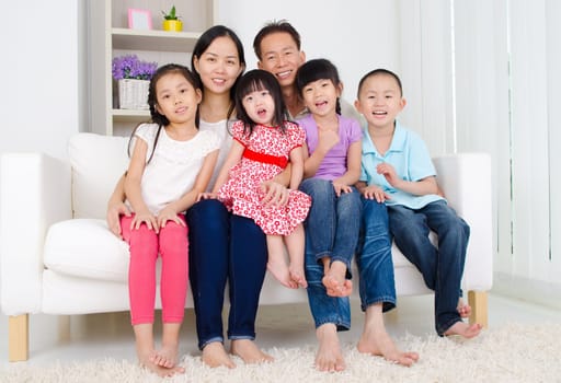 Indoor portrait of asian family