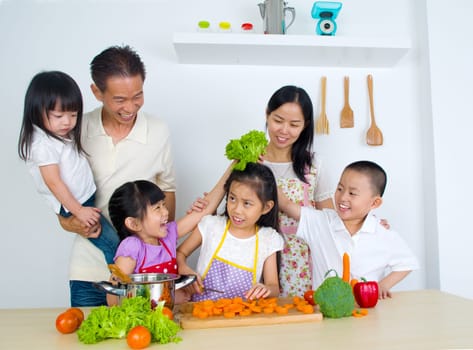 Asian family in the kitchen