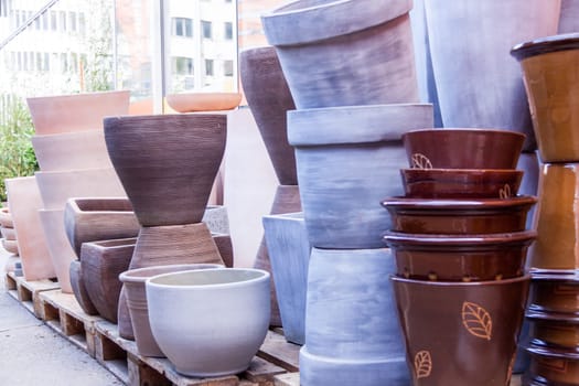 Flower pots made of stone Glazed and unglazed in retail outdoors