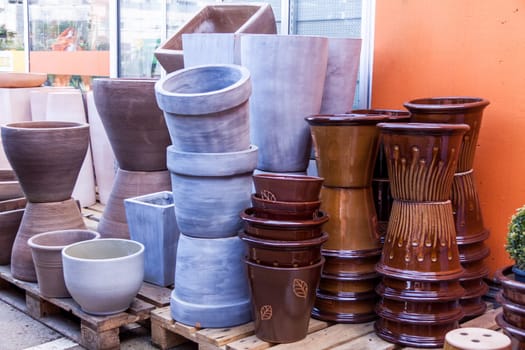 Flower pots made of stone Glazed and unglazed in retail outdoors