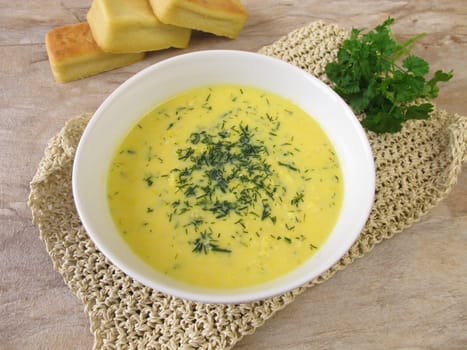 Corn cream soup with garden herbs