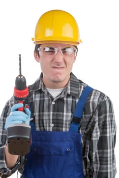 young worker with a drill is angry on the white background