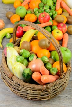 fruit and vegetable basket on the wooden table