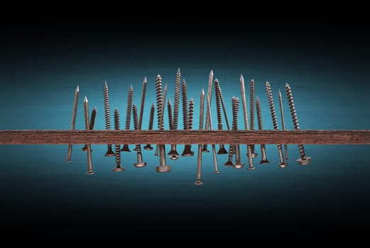 Plank of wood with nails and screws. Clipping path included.