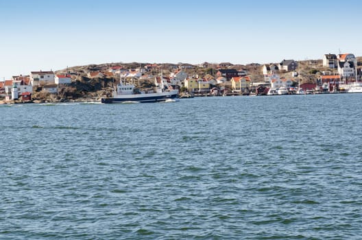 one big fishing boat going out from the harbour to fish