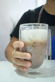Glass Of Iced Milk Coffee Drink, stock photo
