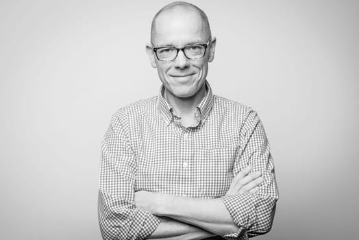 Portrait of a man in the studio against a grey background