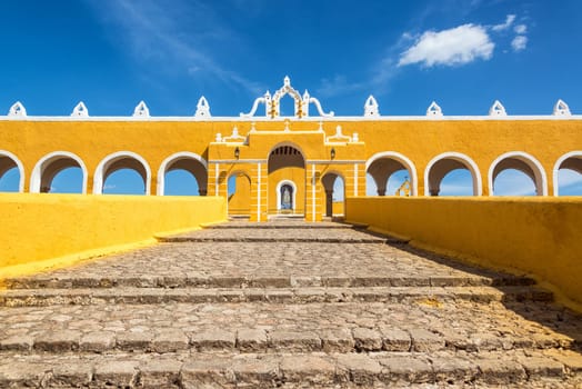 Path leading up to the entrance of the colonial monastery in Izamal, Mexico