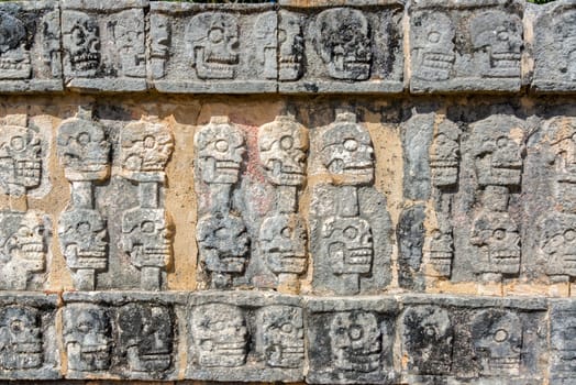 View of the platform of skulls in the ancient Mayan ruins of Chichen Itza in Mexico