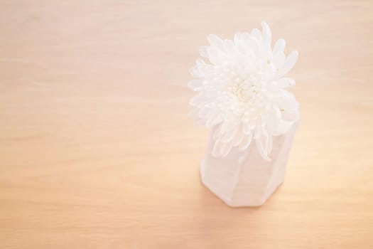 Contemporary Wooden Table With White Flower, stock photo