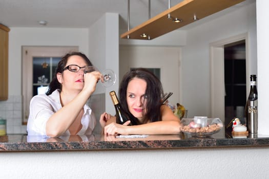 Two drunk young women are celebrating Christmas