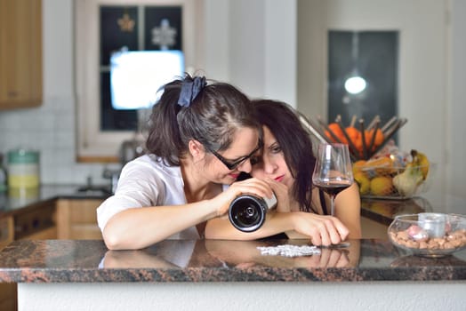 Two drunk young women are celebrating Christmas