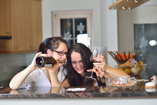 Two drunk young women are celebrating Christmas