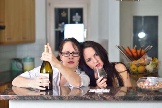 Two drunk young women are celebrating Christmas