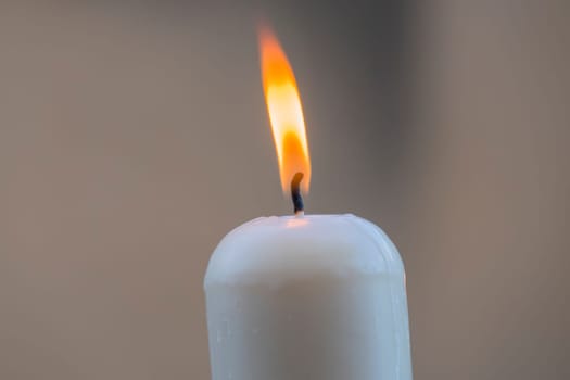 White candle with the flame