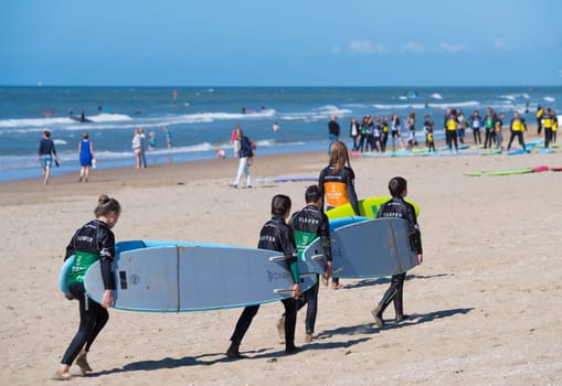 SCHEVENINGEN, NETHERLANDS - JULY 3, 2016: Surf school students in action on the dutch North Sea coast